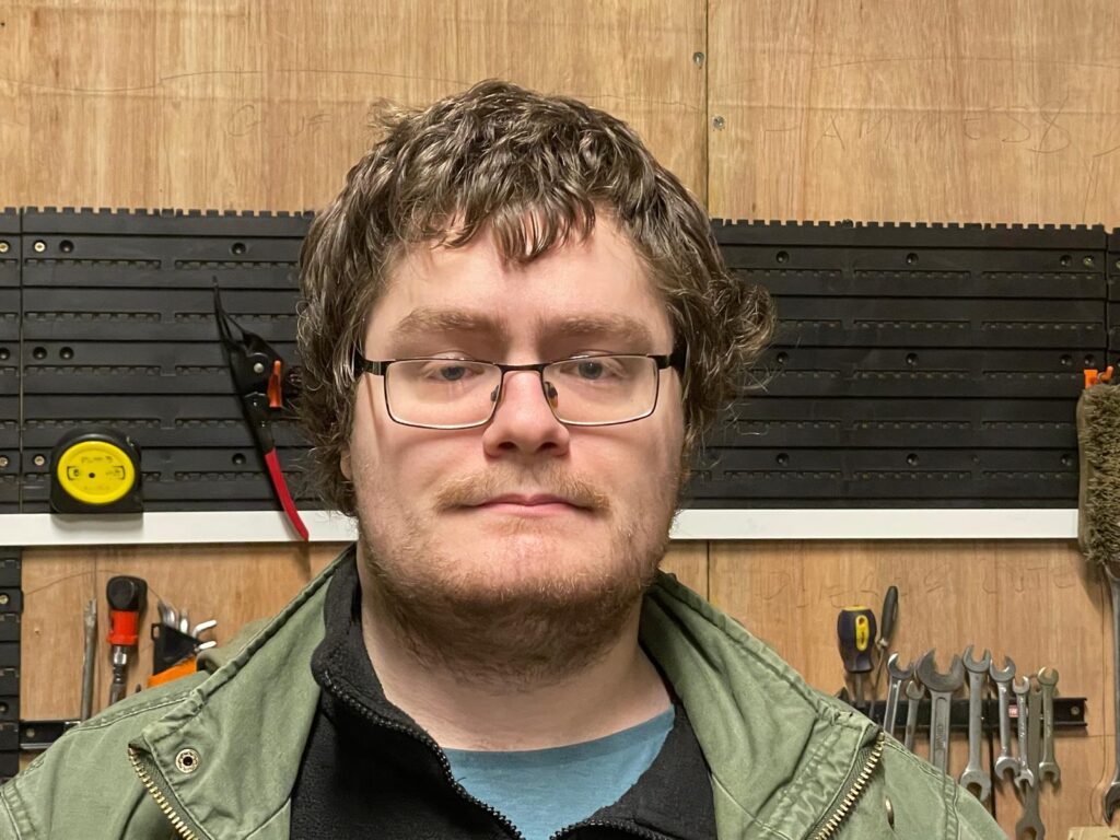 Our skilled technician, Nick Ferriroli, working in the Redhill Shopmobility workshop to ensure every scooter and wheelchair is safe, serviced, and reliable for our members.